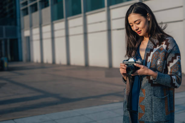 istock Pretty female photographer 1128924684