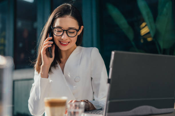 istock Businesswoman talking on mobile phone 1128924843