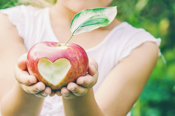 Child with Child with an apple. Selective focus.