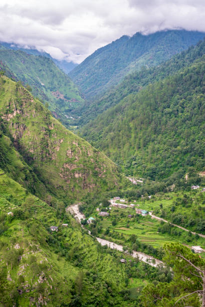 istock mountain range view. Timelapse Of Moving Clouds And Fog over Himalayan mountain range in Sainj 1128926302