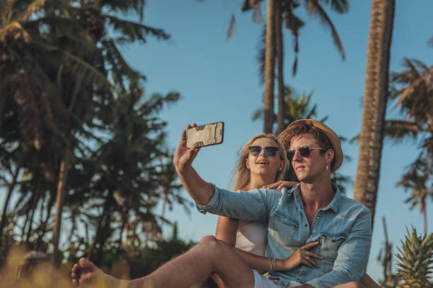 istock Young couple taking a selfie in nature 1128928051