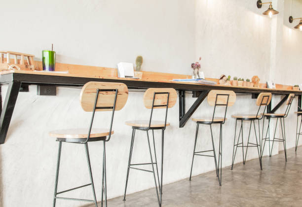 istock Empty on people . Coffee shop interior design With chairs and white walls. 1128928214