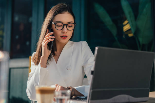 istock Pretty woman talking on mobile phone 1128929310