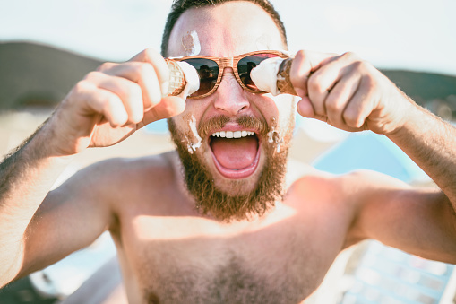 Crazy Male Having Fun And Spilling Ice Cream All Over His Face