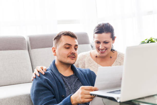 istock Couple Using  Tax Filing Application Online 1128931454