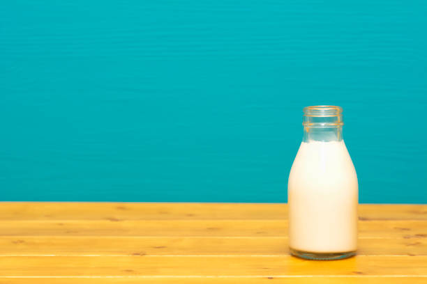 istock Fresh creamy milk in a one-third pint glass bottle 1128931658