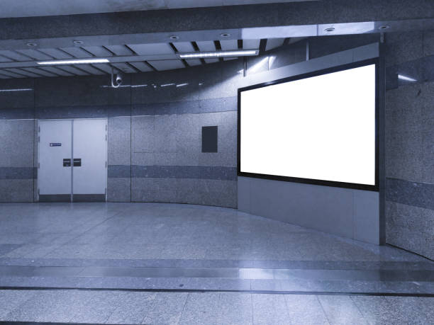 istock blank billboard white screen LED horizontal advertising banner board indoor in subway station public hall. 1128931708