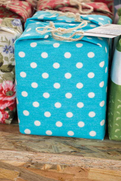 istock Gift box wrapped with blue paper with white dots 1128932722