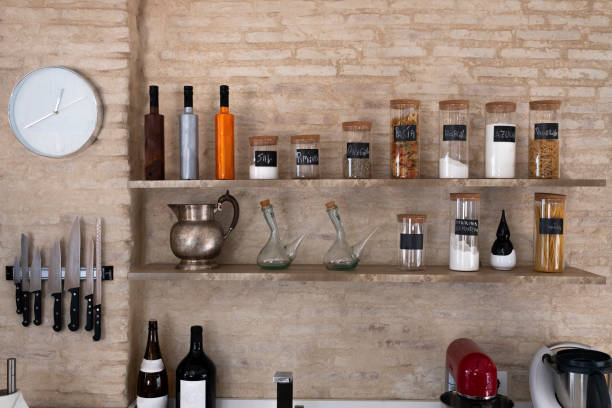 istock Kitchen bench shelves with various food ingredients on brick background 1128932884