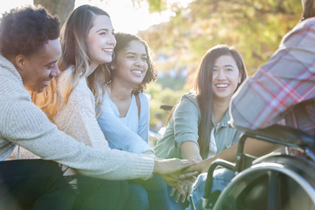 istock Group of united young adults 1128932913