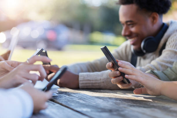 istock Young adults use smartphones 1128932927