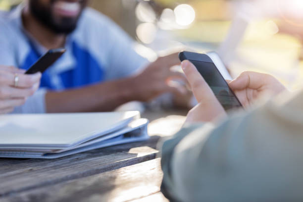 istock Closeup of college student using smartphone 1128932929
