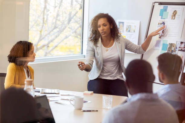 istock Design manager presents new project to her team 1128933029