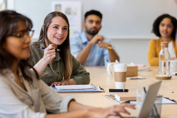istock Young female design professional enjoys brainstorming session 1128933040