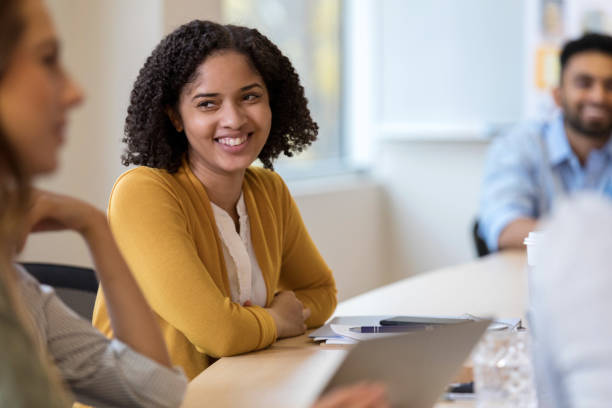 istock Young female design professional enjoys meeting 1128933043