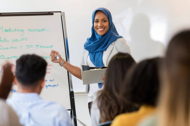 istock Cheerful businesswoman conducts training class 1128933045
