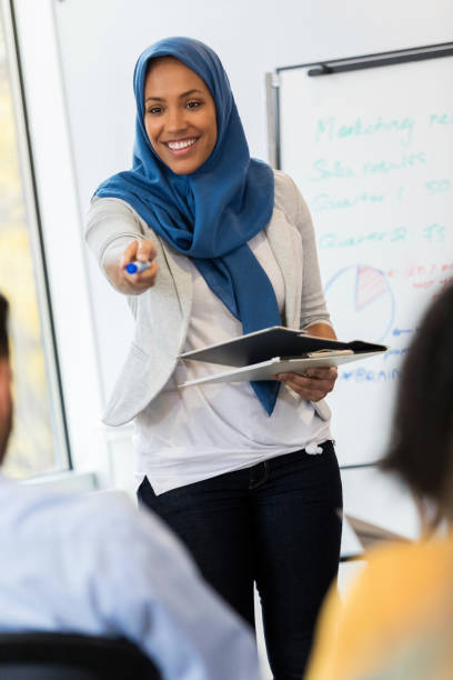 istock Closeup of businesswoman conducting training class 1128933049