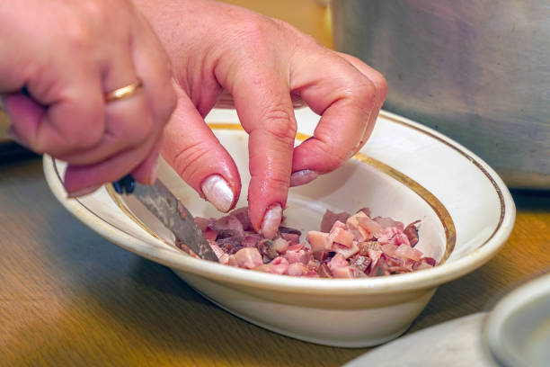 Sliced fish meat for salad. Finely chopped fish. Selective focus