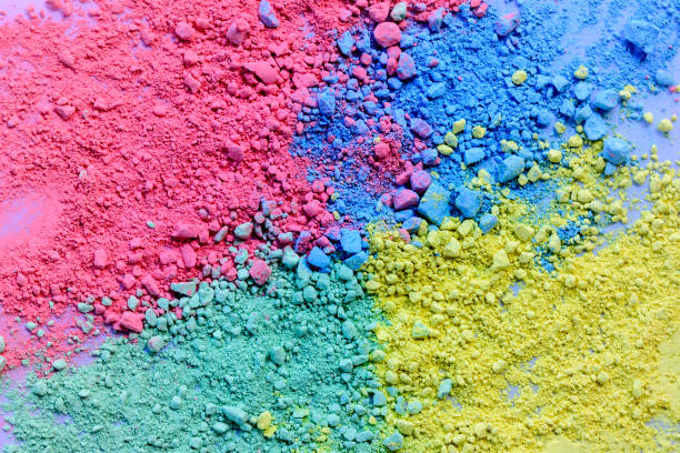 istock Colorful background of chalk powder. Multicolored dust particles splattered on white background. 1128935017