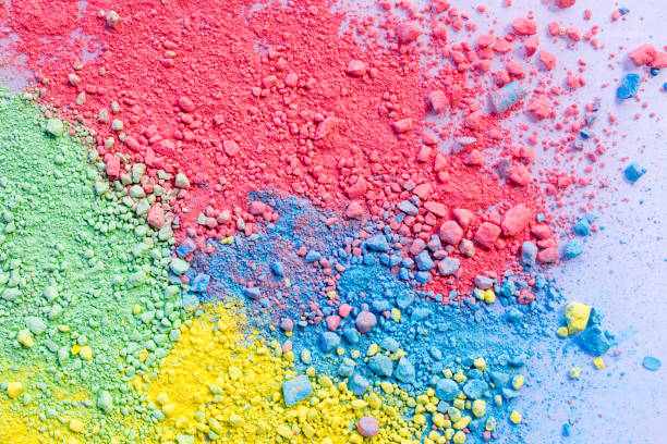 istock Colorful background of chalk powder. Multicolored dust particles splattered on white background. 1128935036