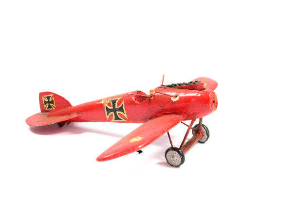 istock Vintage Toy Aeroplane on White Background 1128935221