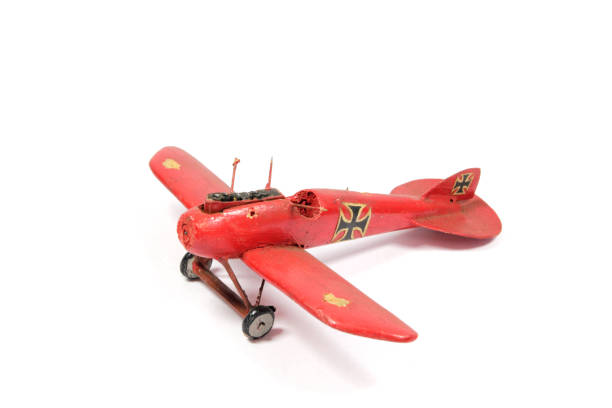 istock Vintage Toy Aeroplane on White Background 1128935562