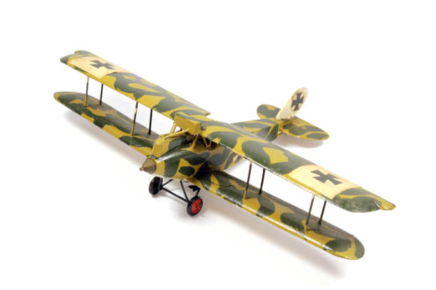 istock Vintage Toy Aeroplane on White Background 1128936167