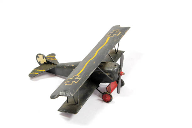 istock Vintage Toy Aeroplane on White Background 1128936286