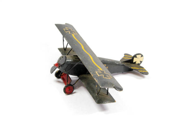 istock Vintage Toy Aeroplane on White Background 1128936392