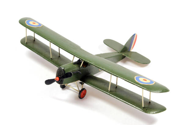 istock Vintage Toy Aeroplane on White Background 1128936730