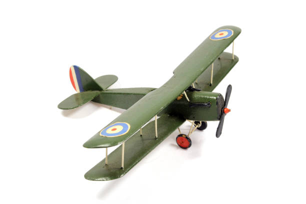 istock Vintage Toy Aeroplane on White Background 1128936755