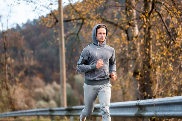 istock Young male athlete running in the nature 1128937204