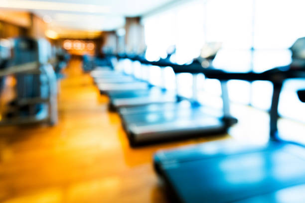 A row of treadmills at the modern gym