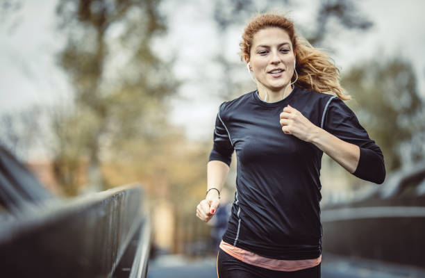 istock Female Athlete Running Outdoors 1128938009