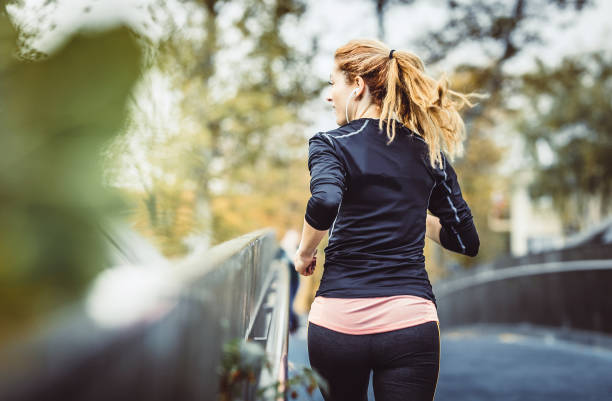 istock Female Athlete Running Outdoors 1128938051