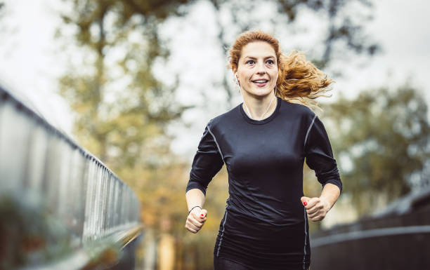 istock Female Athlete Running Outdoors 1128938128