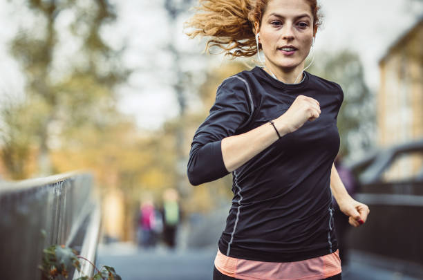 istock Female Athlete Running Outdoors 1128938156