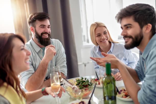 istock Friends having lunch at home 1128938311
