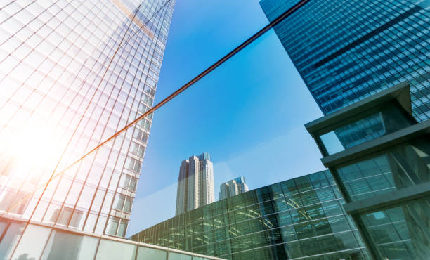 istock Modern building is reflecting on the glass wall 1128938340