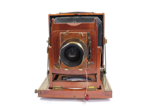 istock Vintage Antique Old Fashioned Camera On White Background 1128938716