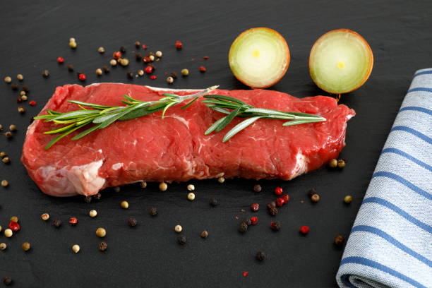 Raw beef steak for grilling and frying stock photo