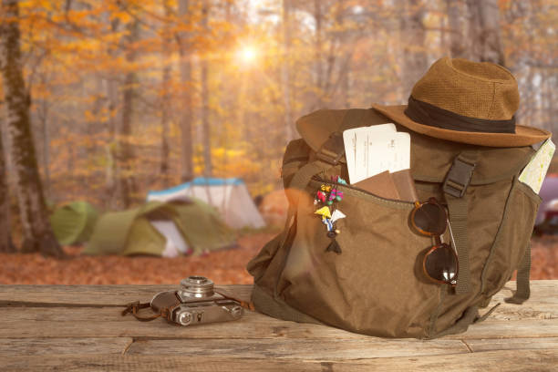 istock travel concept backpack over wooden table 1128940568