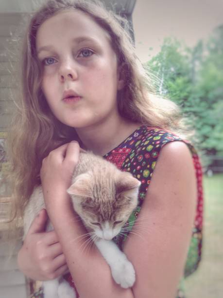 istock Holding my kitten on the farm, outdoors during spring 1128941127