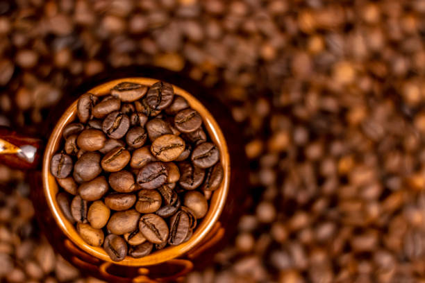 istock Cup of coffee beans, on old rusty background. Soft focus, copy space. 1128942668