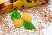 clafoutis fruit pie with  yellow raspberry close up.