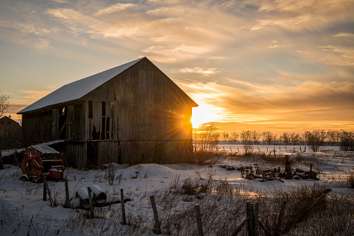 Sunset over a barn in Canada