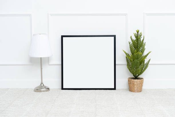 istock There are beautiful flowers and various objects near the rectangle blank picture frame. 1128944567
