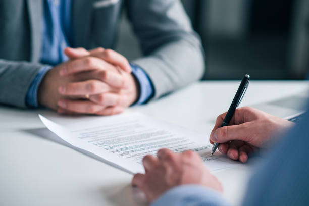 istock Business man signing contract. 1128944858