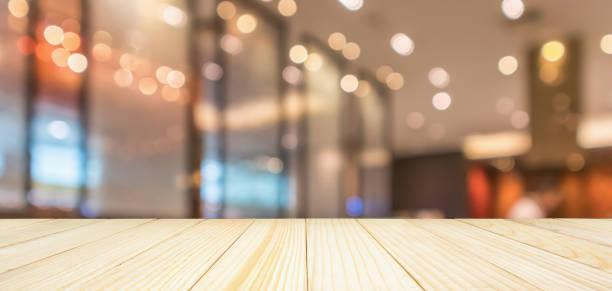 istock Restaurant interior with customer and wood table top over blur abstract background with bokeh light 1128945263