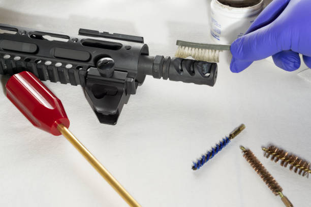 istock Rifle and Bore brush, coated rods on white background. Cleaning gun 1128945469
